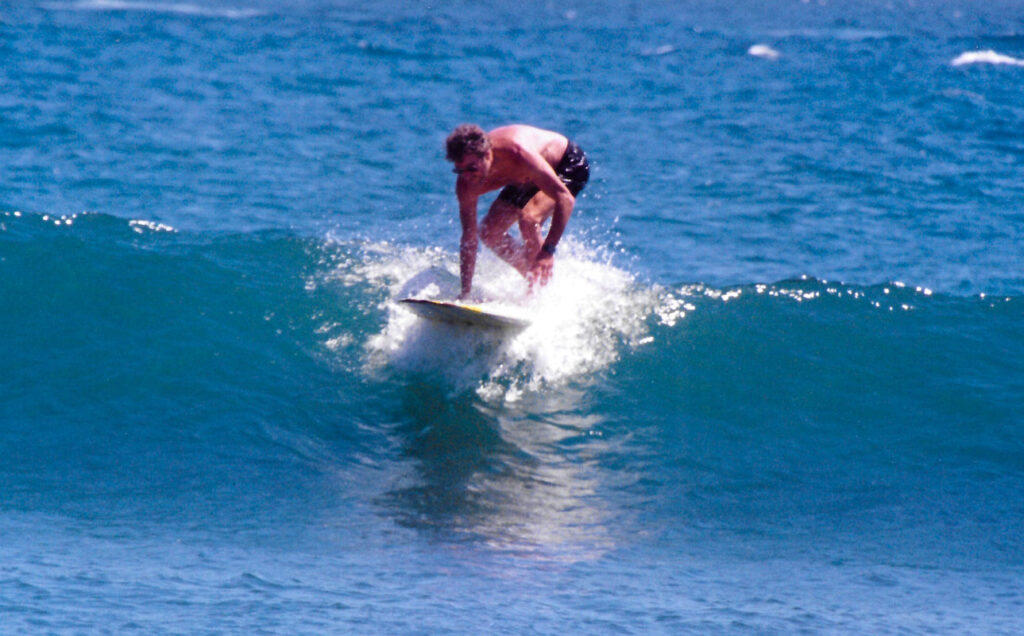 Kim Guggenheim surfing at Surfrider beach